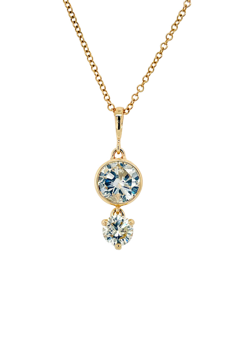 Custom 14k yellow gold pendant with a bezel set diamond and a prong set diamond