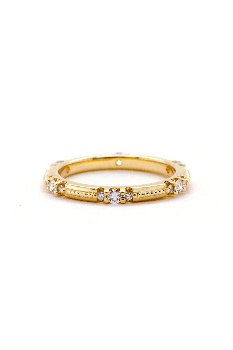 Custom 14k yellow gold wedding band with beads down the center and 6 clusters of three diamonds set in prongs