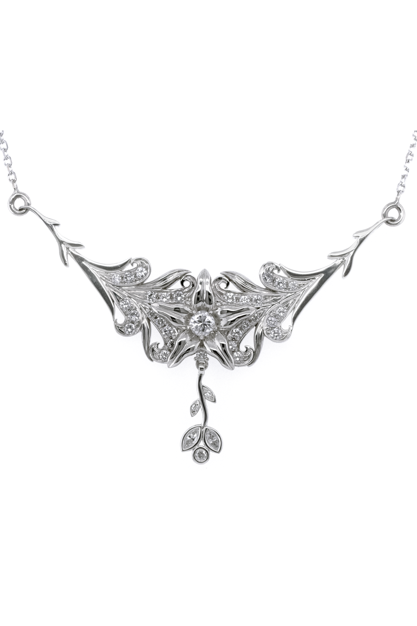Custom 14k white gold large pendant and chain with a flower ing the center, curls and leaves growing up toward the flower, and a dangle leaf component, all with diamond pave covering most of the details