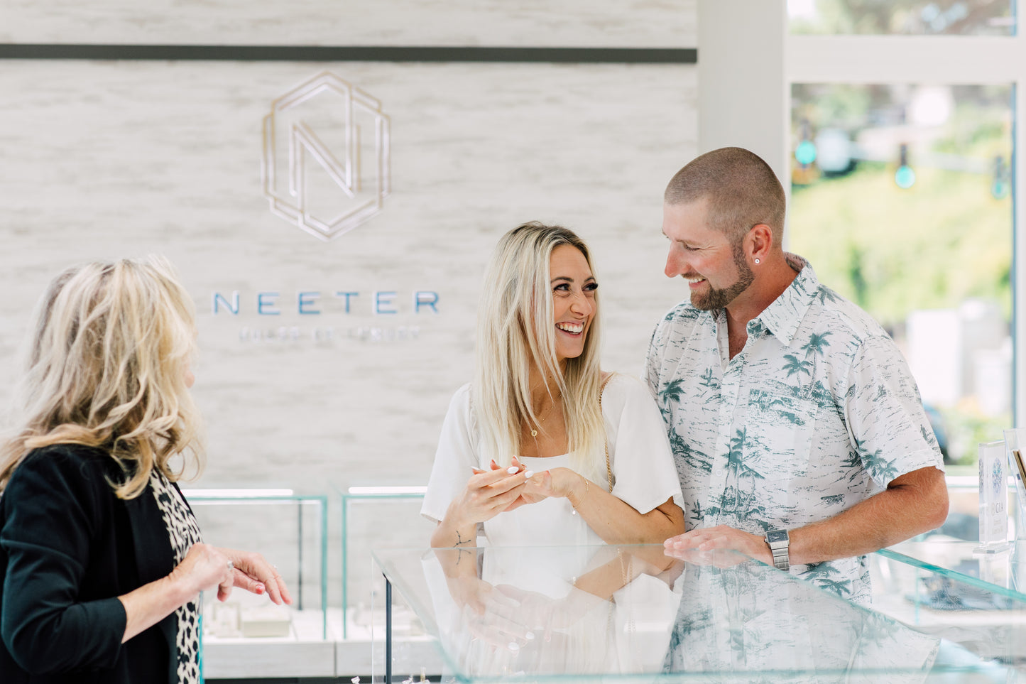 a couple picks out an engagement ring at the neeter house of luxury showroom in bellingham, wa